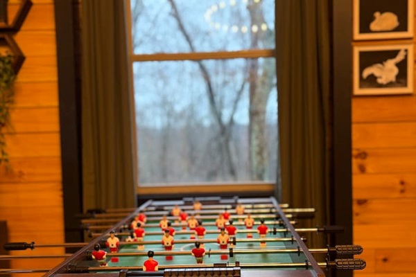 Foosball game with forest views