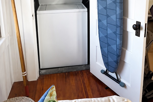 Our washer, iron and ironing board are inside this first bedroom!
