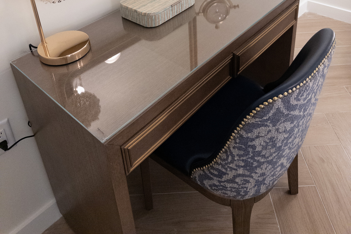 Thoughtful details - a styled console and bedside lighting set a refined mood.