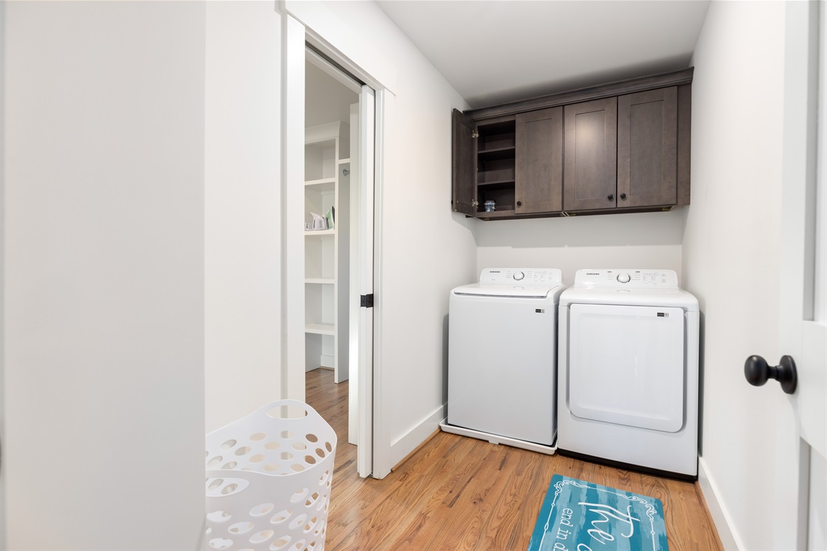 A washer and dryer with the supplies you need.