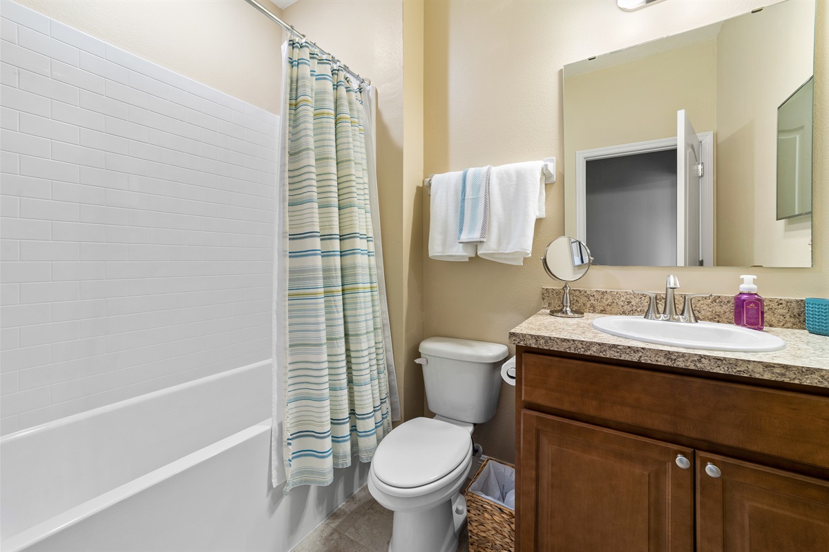 Full Bathroom in hallway with tub/shower