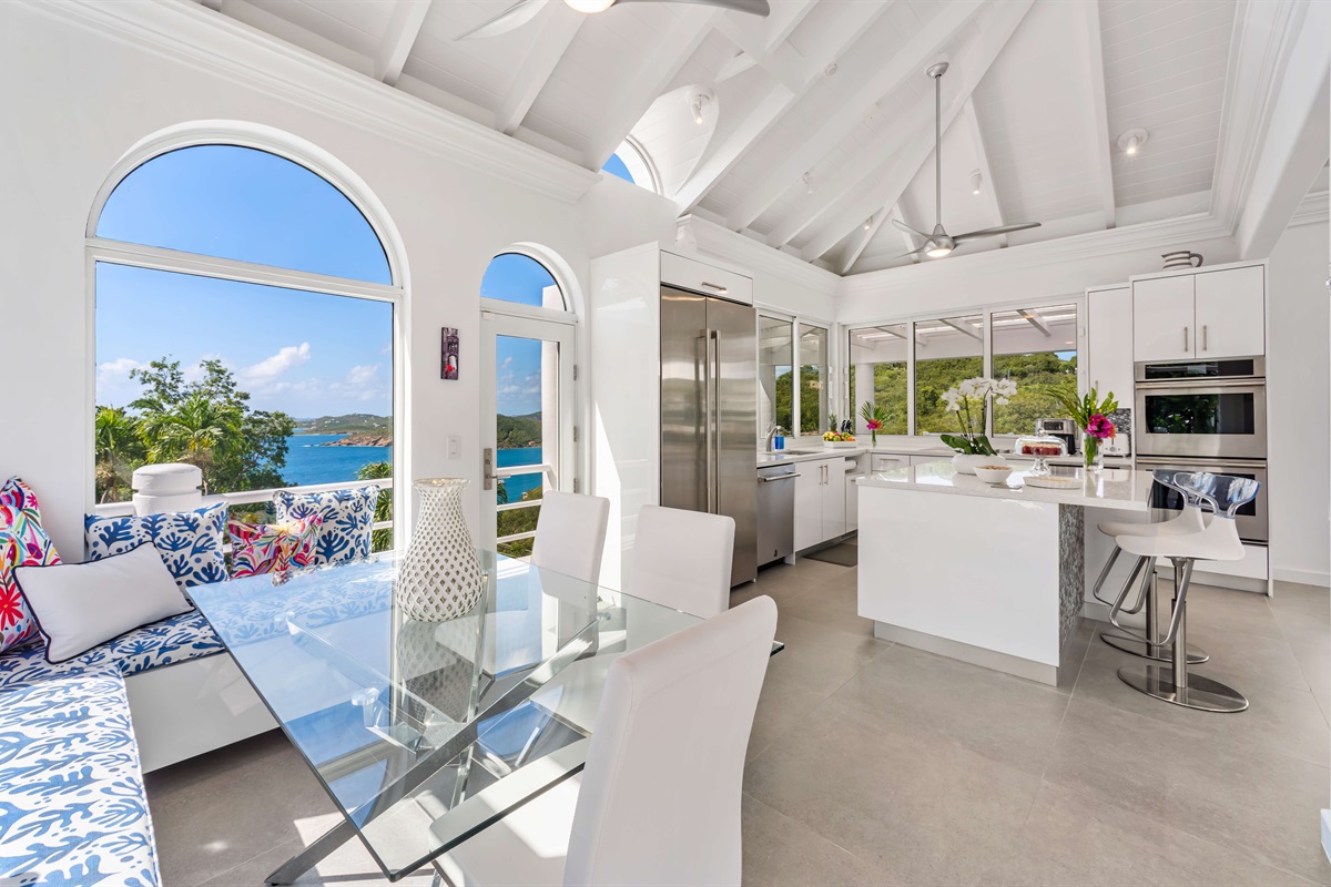 Seating at the kitchen island and dining area.  **Please note that the oven in the photo is under repair at this time**