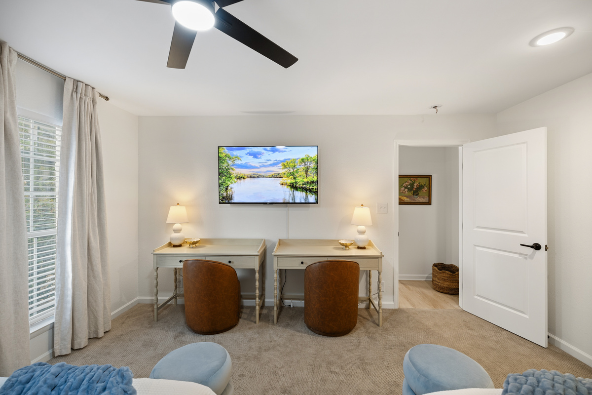 Two desks, two leather swivel chairs, two lamps. Set up side by side for work or turn it into a getting-ready station.