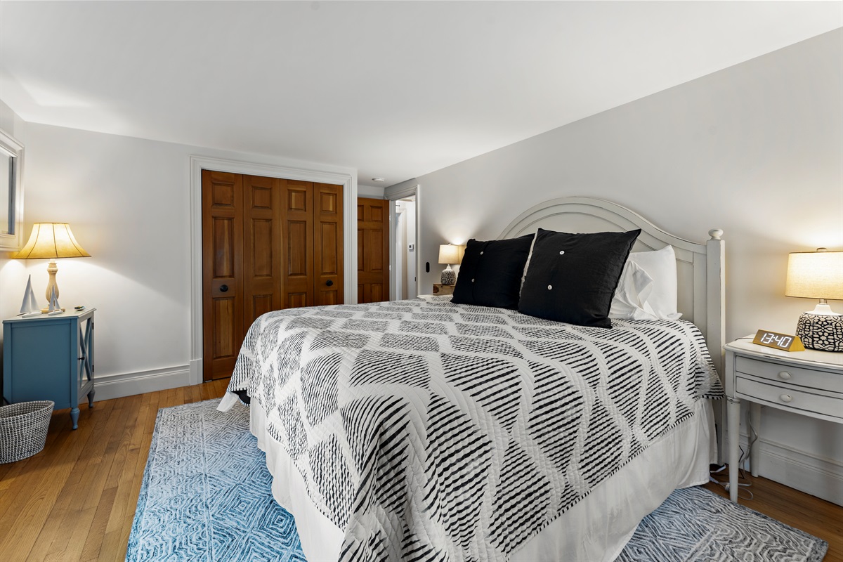 A spacious bedroom, where comfort and relaxation meet in a king bed.