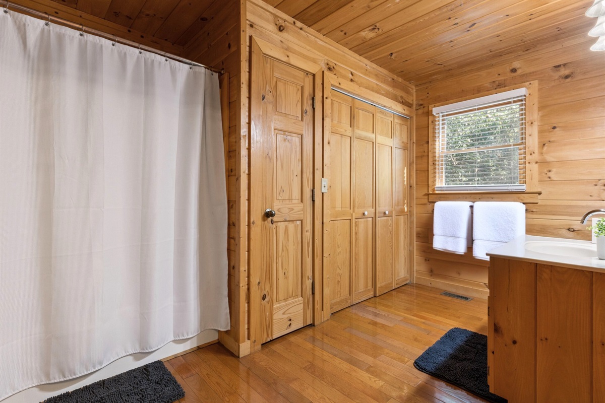 Rustic charm and cozy details make every shower feel inviting.