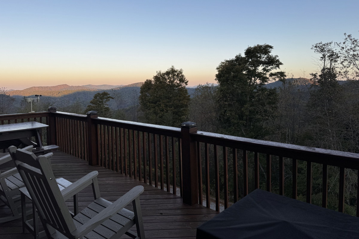 Adirondack chairs on the deck offer a peaceful spot to take in the mountain views at dusk.