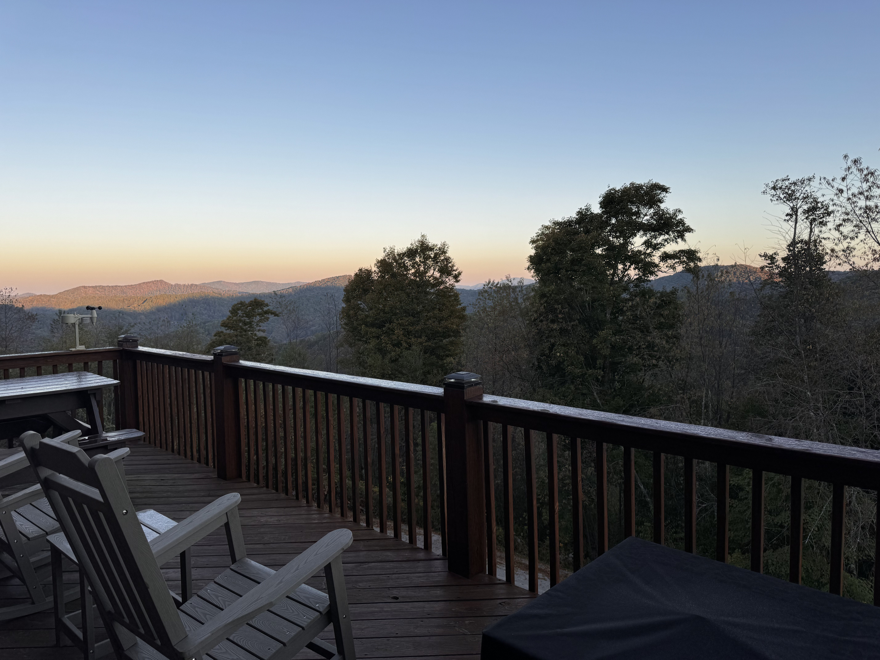 Adirondack chairs on the deck offer a peaceful spot to take in the mountain views at dusk.