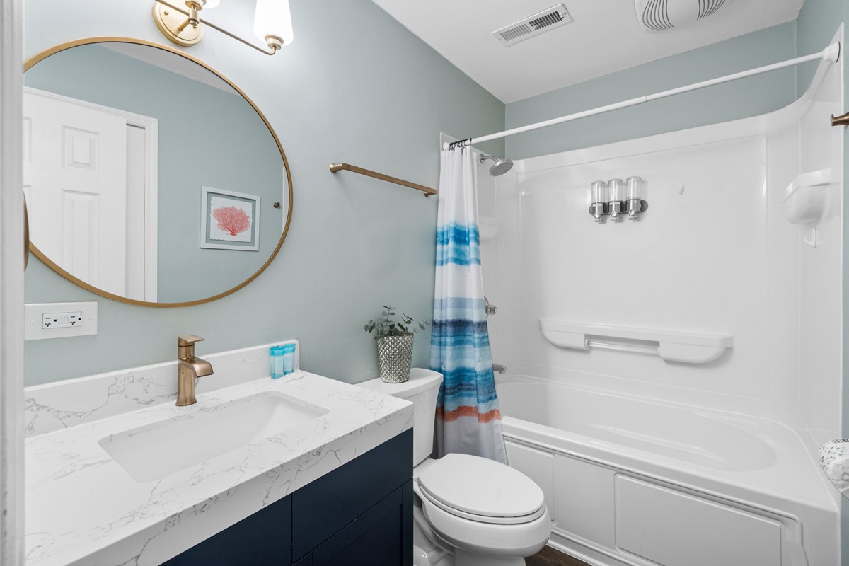 Hallway Bathroom 2 With Tub and Shower Combo | Shared by Bedroom 2 and 4 | IOP Escapes Beach Blessing | 3705 Hartnett Blvd, Isle of Palms, SC