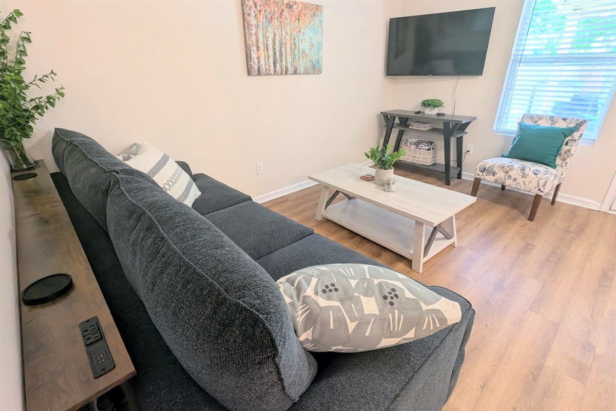Convenient charging station located behind the couch. 