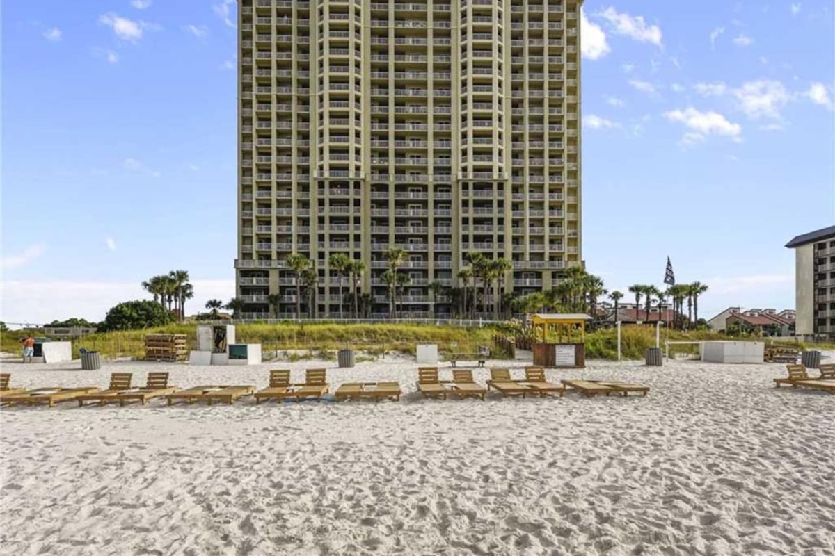 View of the condo as you are  walking back from taking a dip in the ocean. 