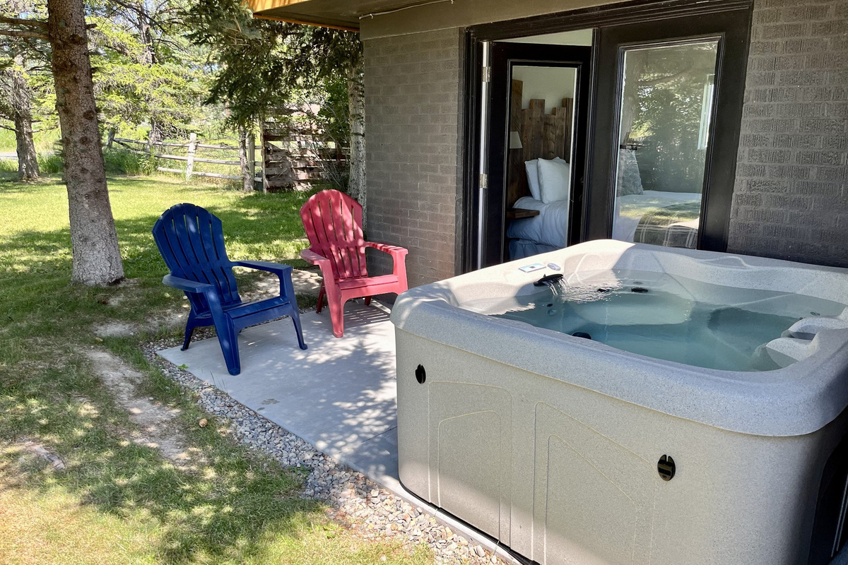 Private hot tub steps from the patio — soak under the stars