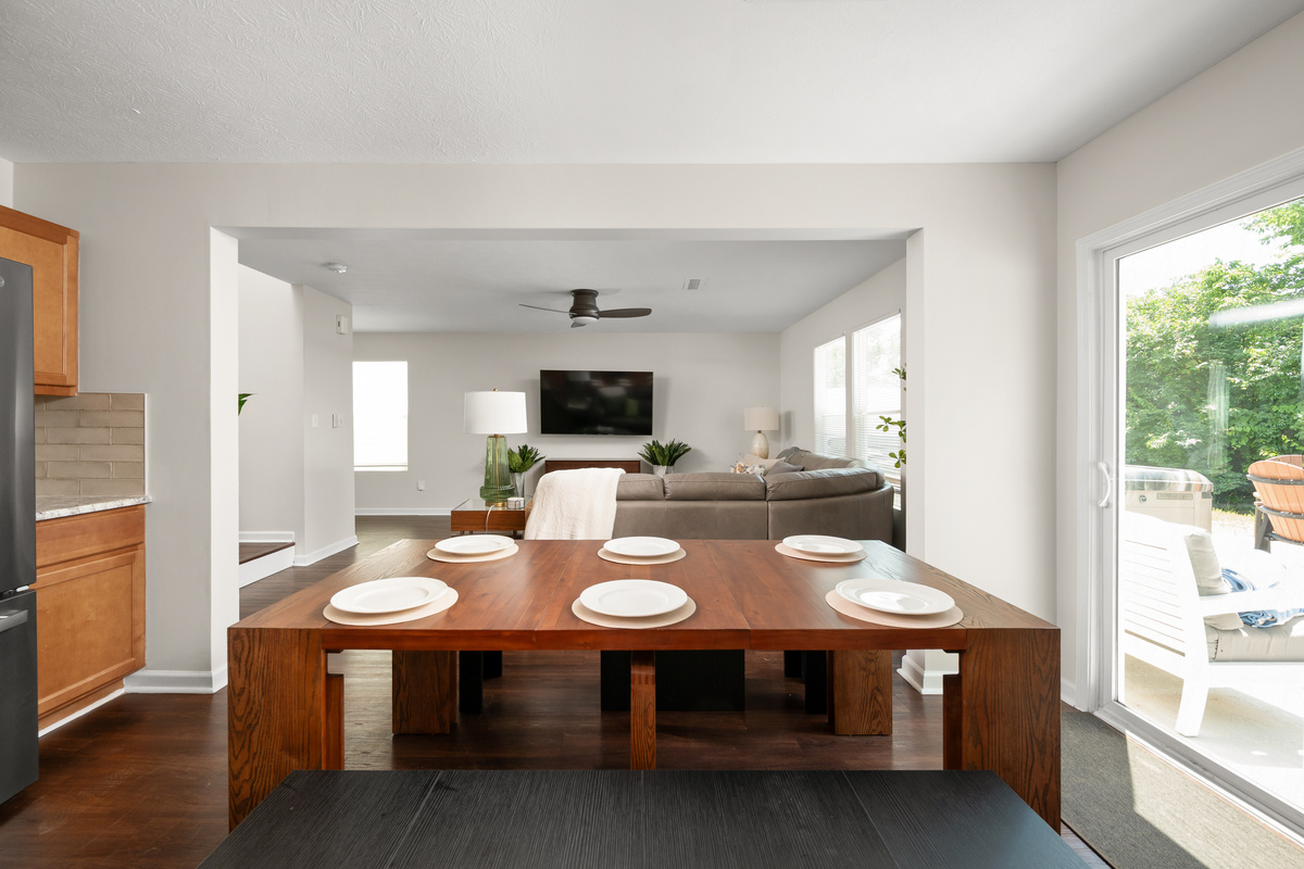 The open-concept dining area seamlessly connects the kitchen and family room, making it easy to share meals, conversation, and quality time together.