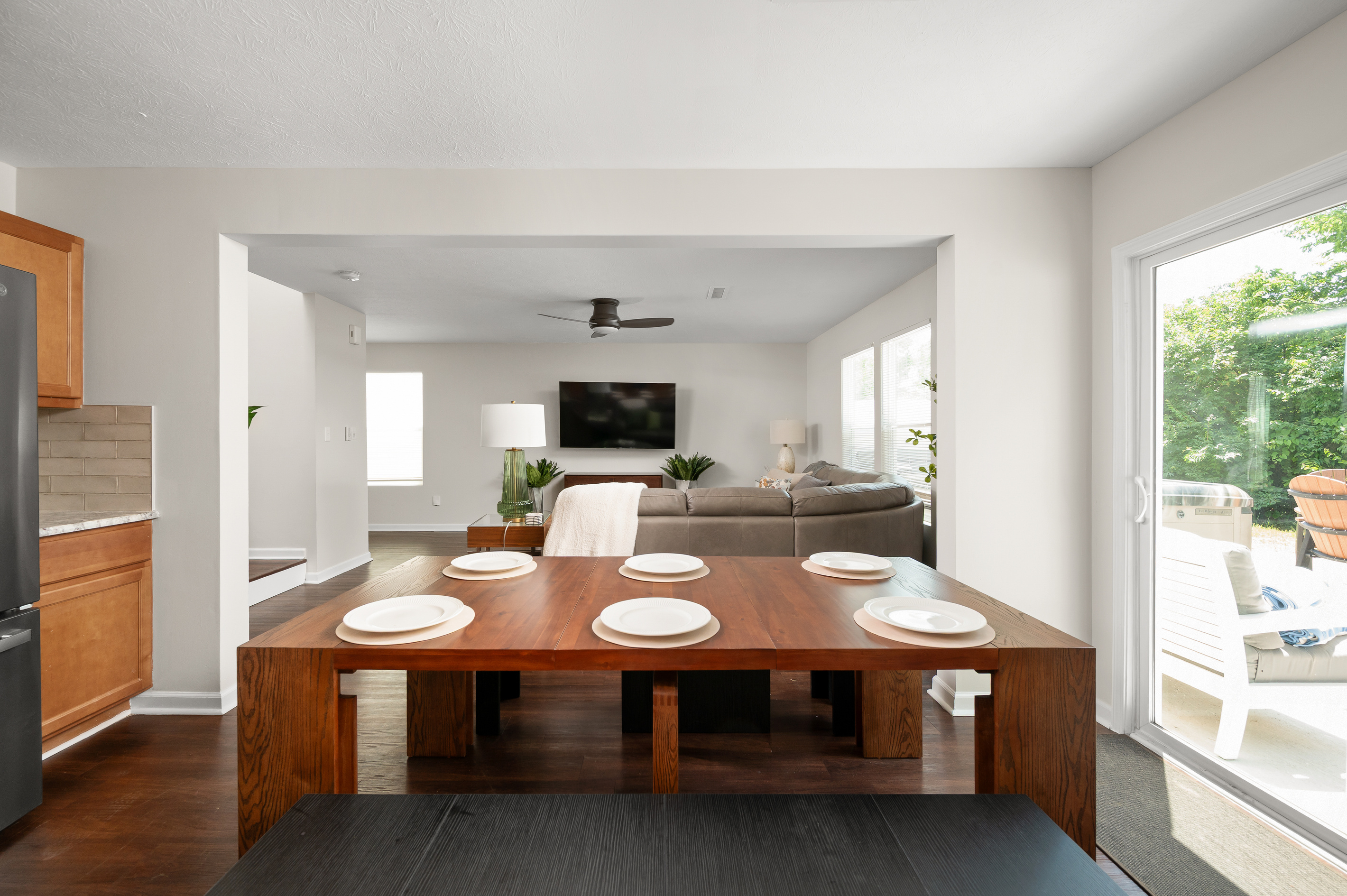 The open-concept dining area seamlessly connects the kitchen and family room, making it easy to share meals, conversation, and quality time together.