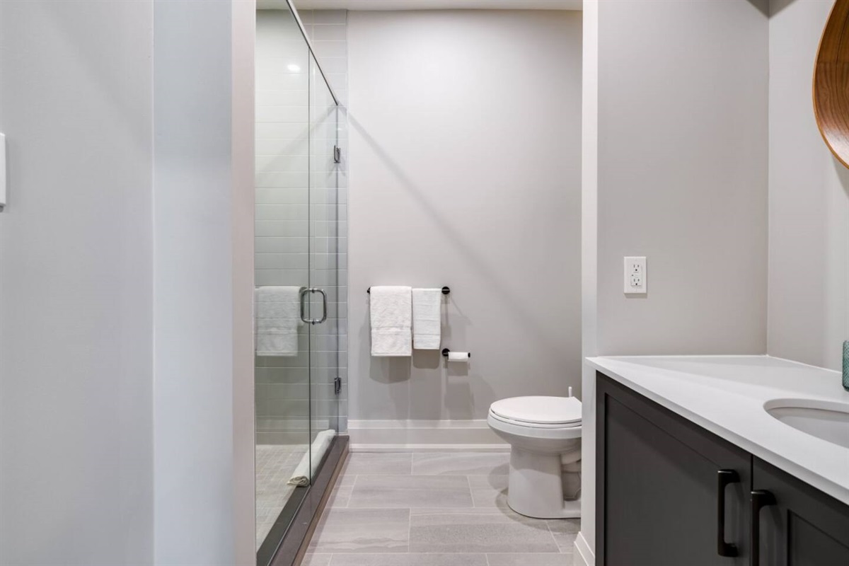 A private ensuite with a  walk-in shower completes the upstairs king retreat.