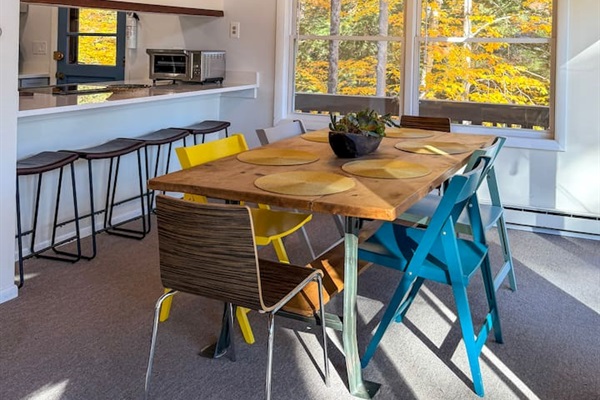 Dining table with seating for 6, plus 4 spots at the counter