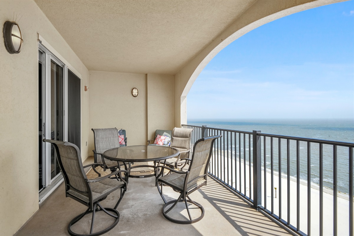 Current furnishing on balcony: 4 top dining and two comfortable chairs.