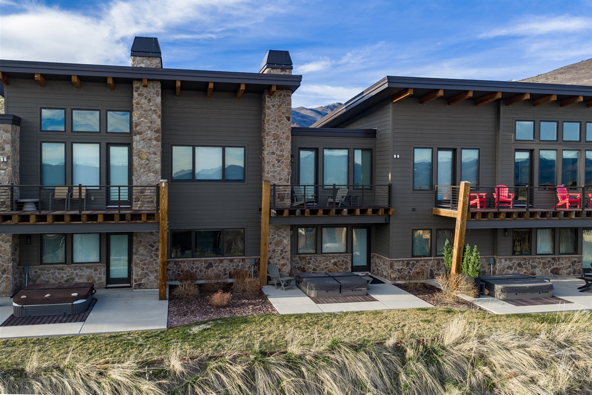 Rear exterior with private patios and outdoor spaces