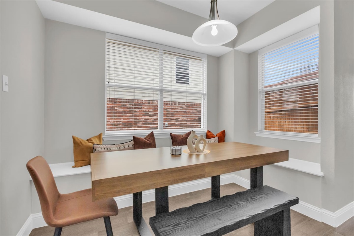 Casual kitchen nook with seating for seven, perfect for everyday meals, coffee, or quick bites.