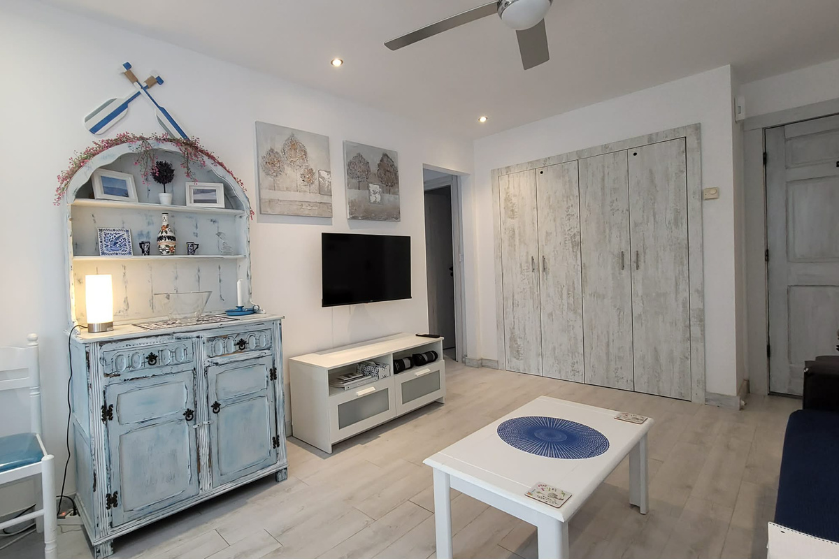 Living Area with Smart Flat Screen TV with Apps, Ceiling Fan and Remote Controlled Air Conditioner