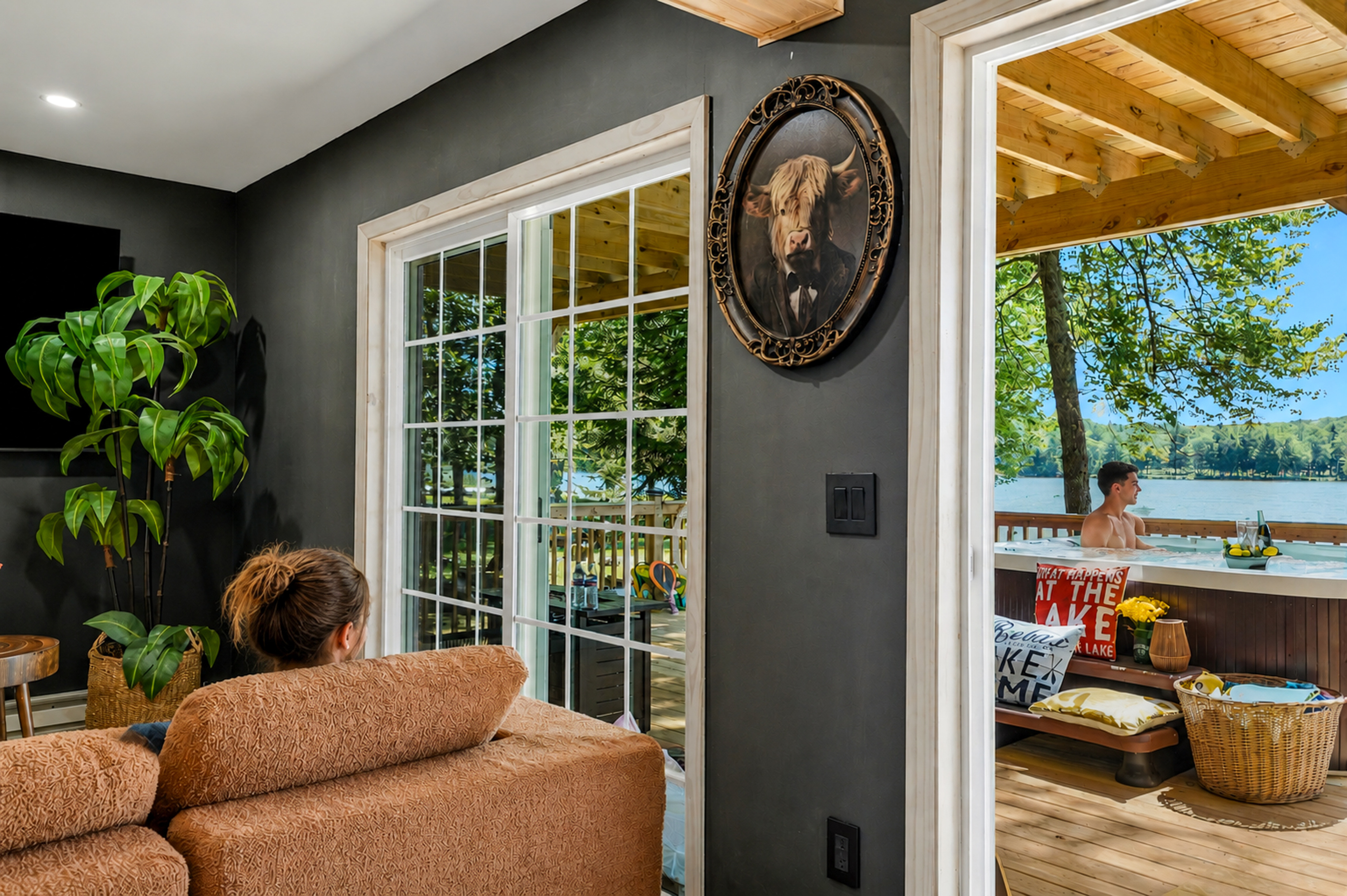 Lower-level living room with lake light pouring through the French doors