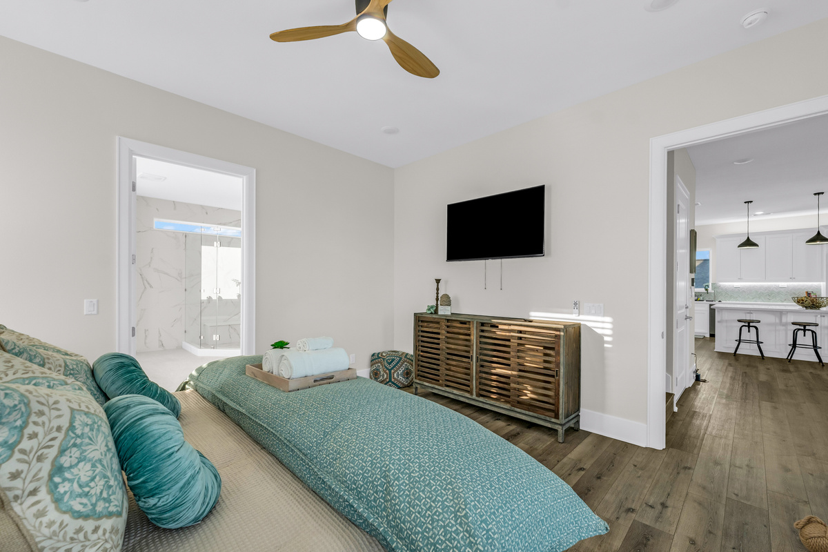 Costa Cristal Primary Ensuite: First-floor primary bedroom with a king-size bed and mounted TV for relaxing entertainment.
