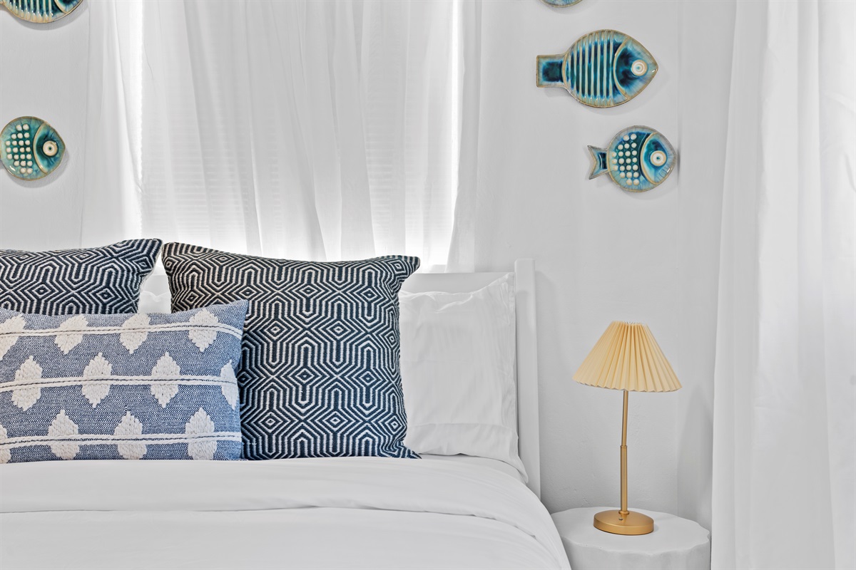 Breezy blues and elegant details bring refined beach-house charm to every stay.