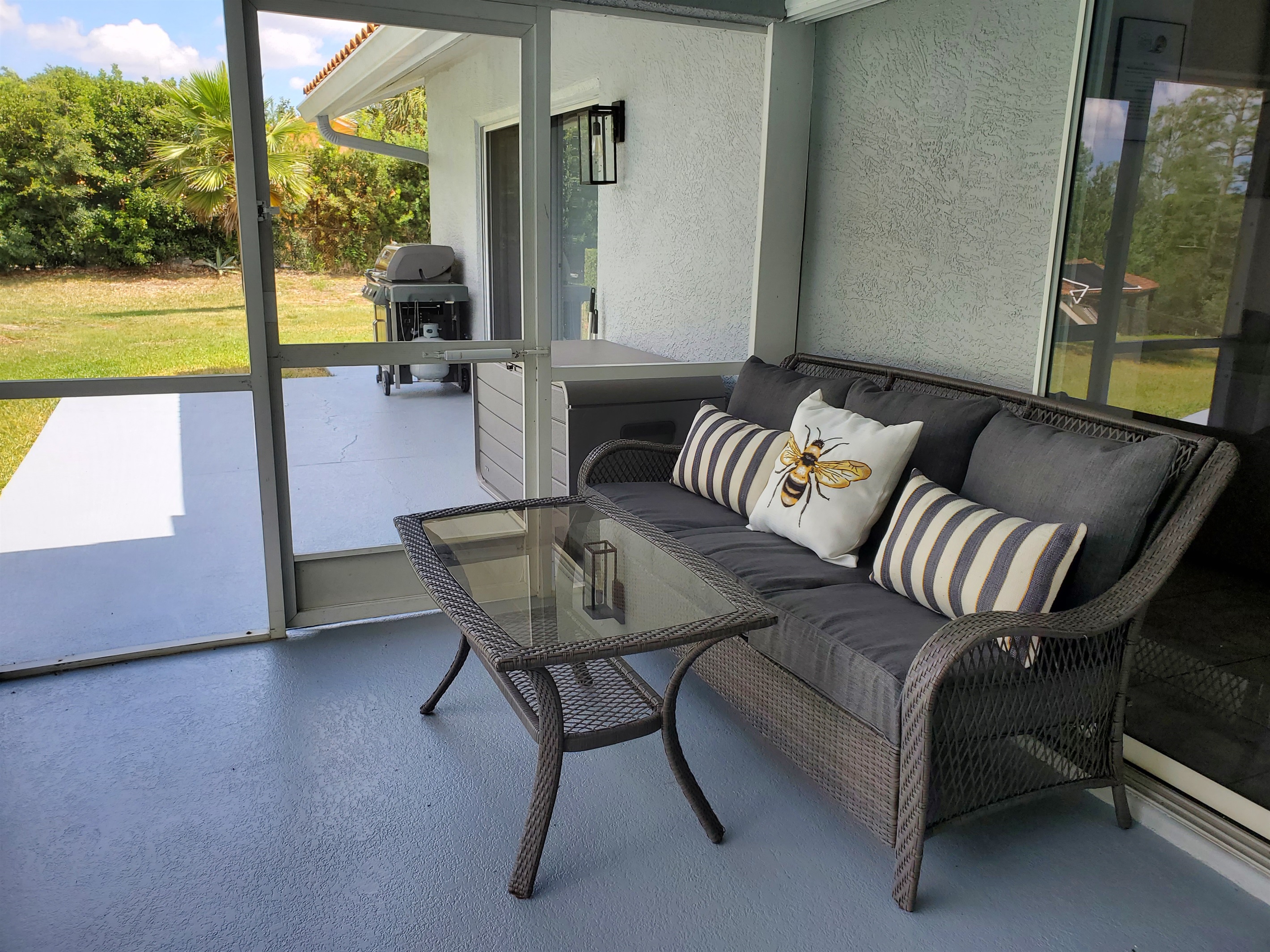 Lanai seating and BBQ for guest use