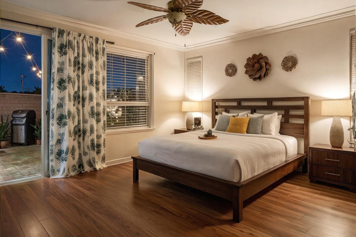 King bedroom with ensuite bath, walk-in closet and access to patio