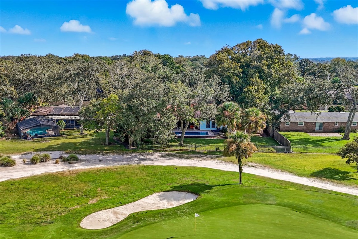 Arial view of the home next to the golf course