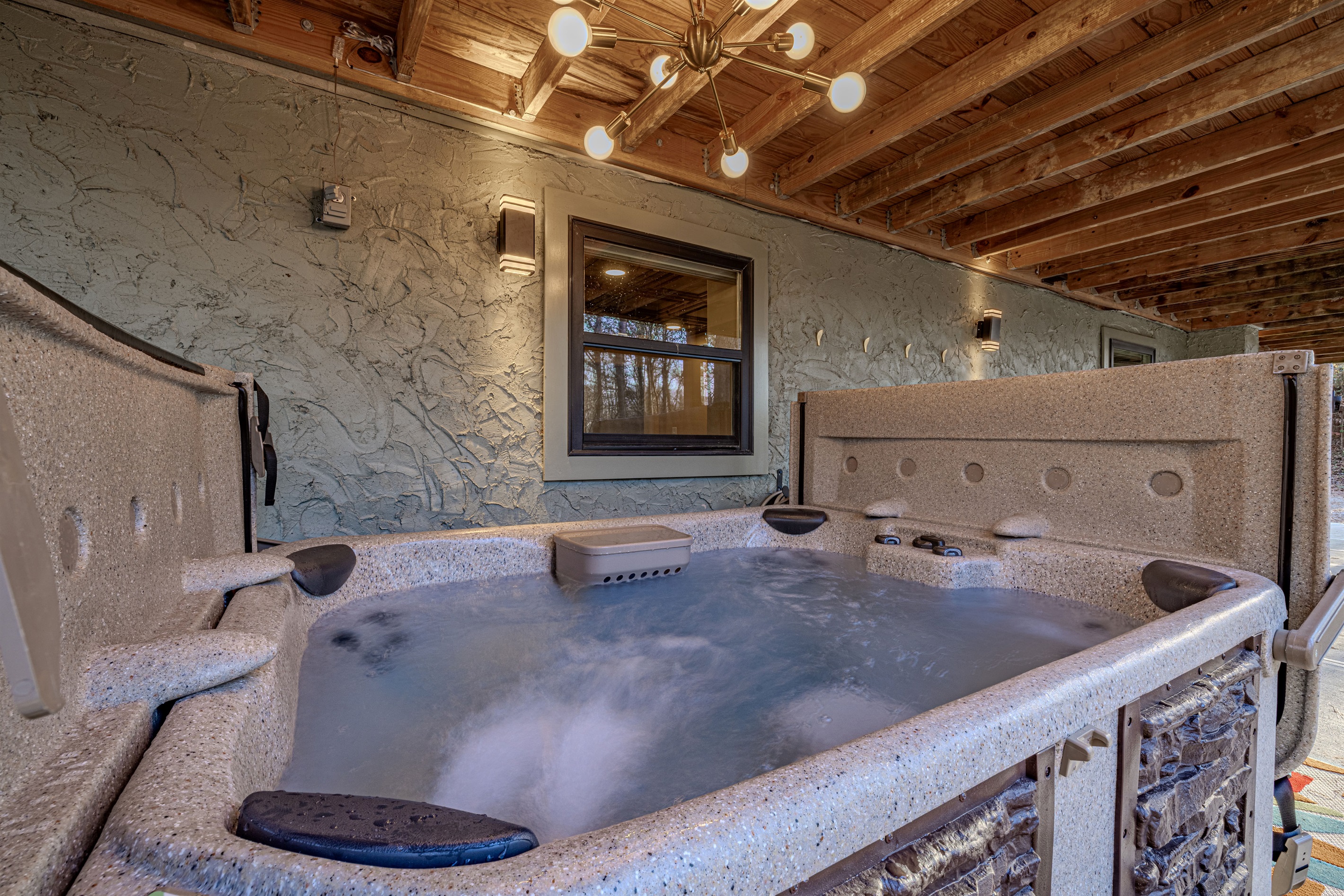 Soak your stress away! Enjoy this private, bubbling hot tub tucked away just steps from the house. Perfect for unwinding.
