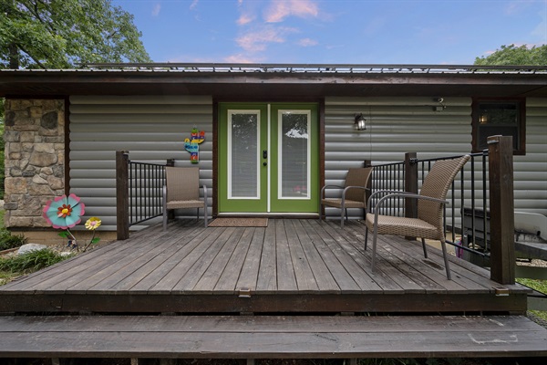 Back porch that leads into the kitchen, with a grill provided.