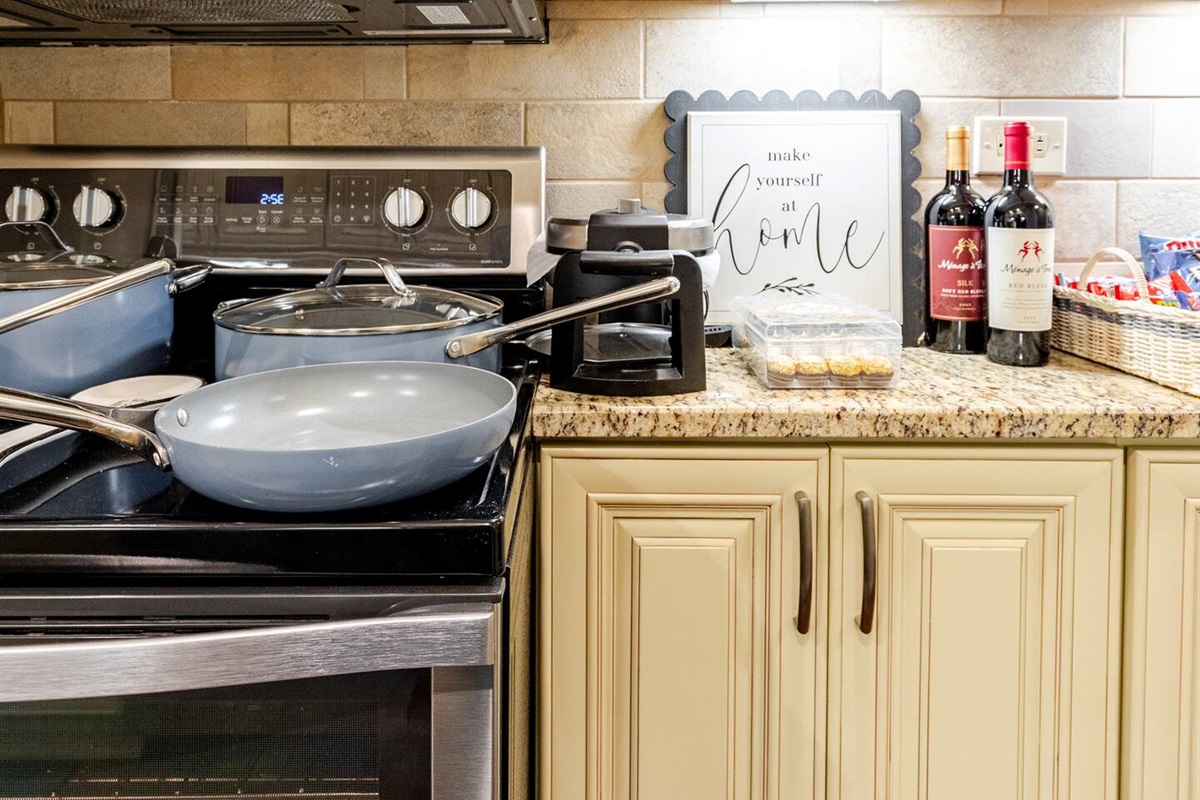 Sleek kitchen w/ modern cabinets & ample counter space for easy meals.