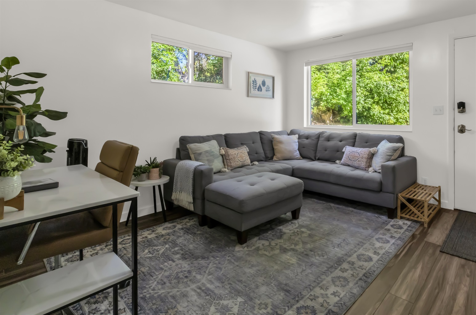 Cozy living room with large windows, very private space.