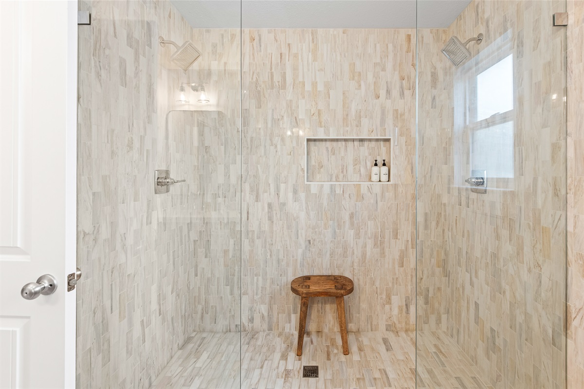 Bedroom 1: Experience a spa-like retreat in this oversized, newly renovated walk-in shower.