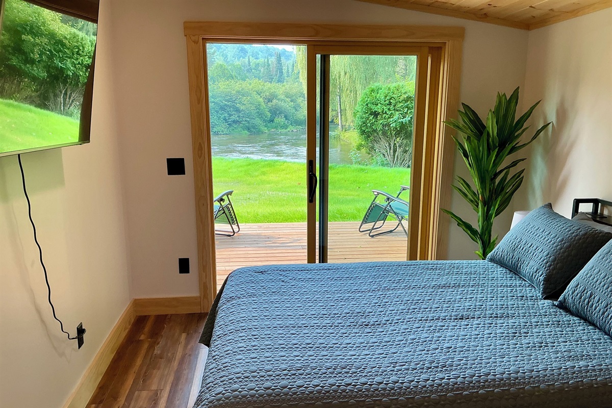 Master bedroom with private deck view of the river