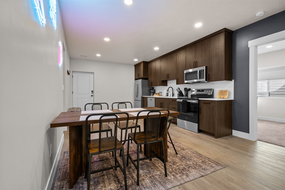 Modern kitchen and dining area with seating for six.