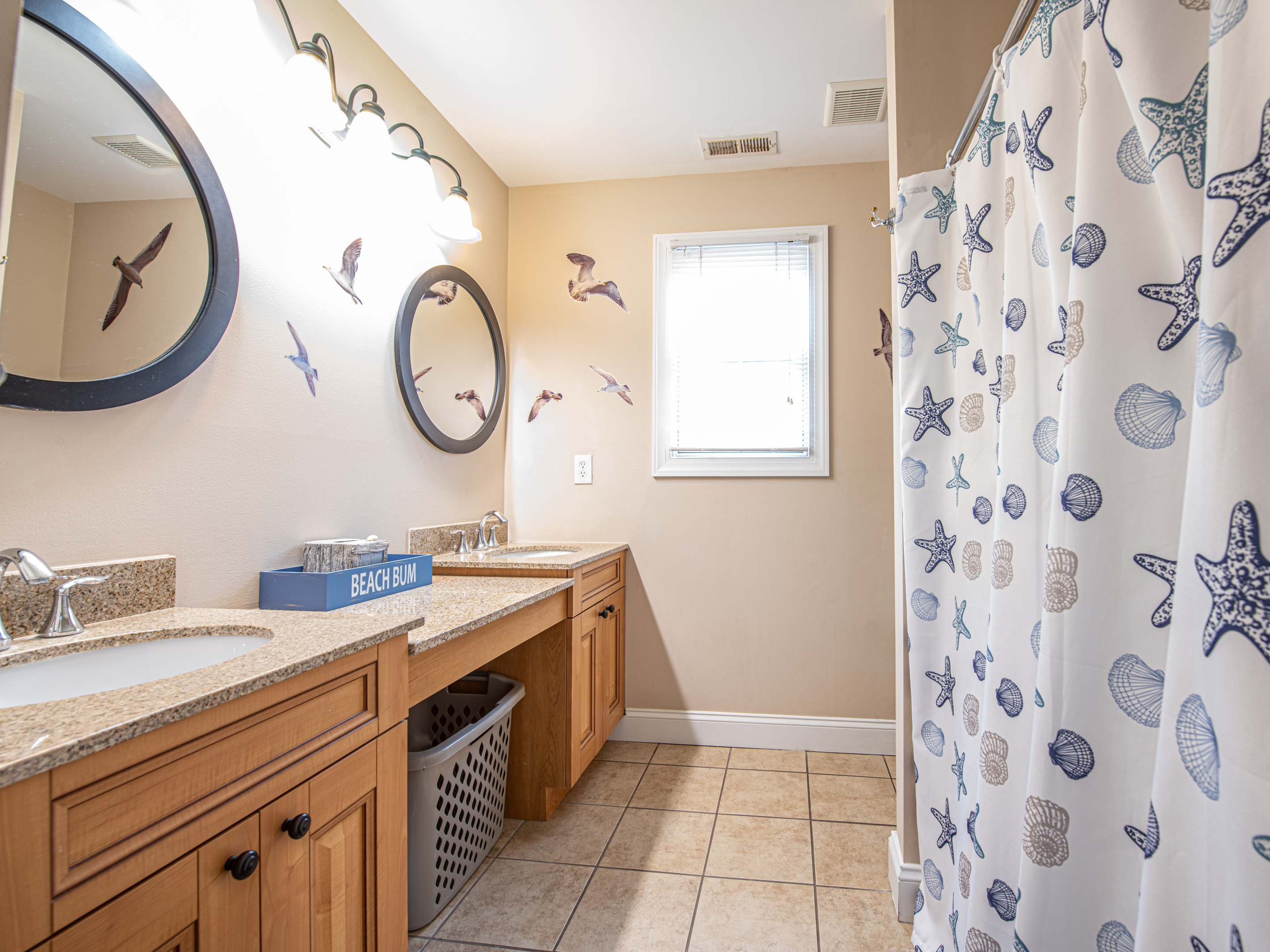 Bathroom 1 with Double Vanity and Coastal Decor