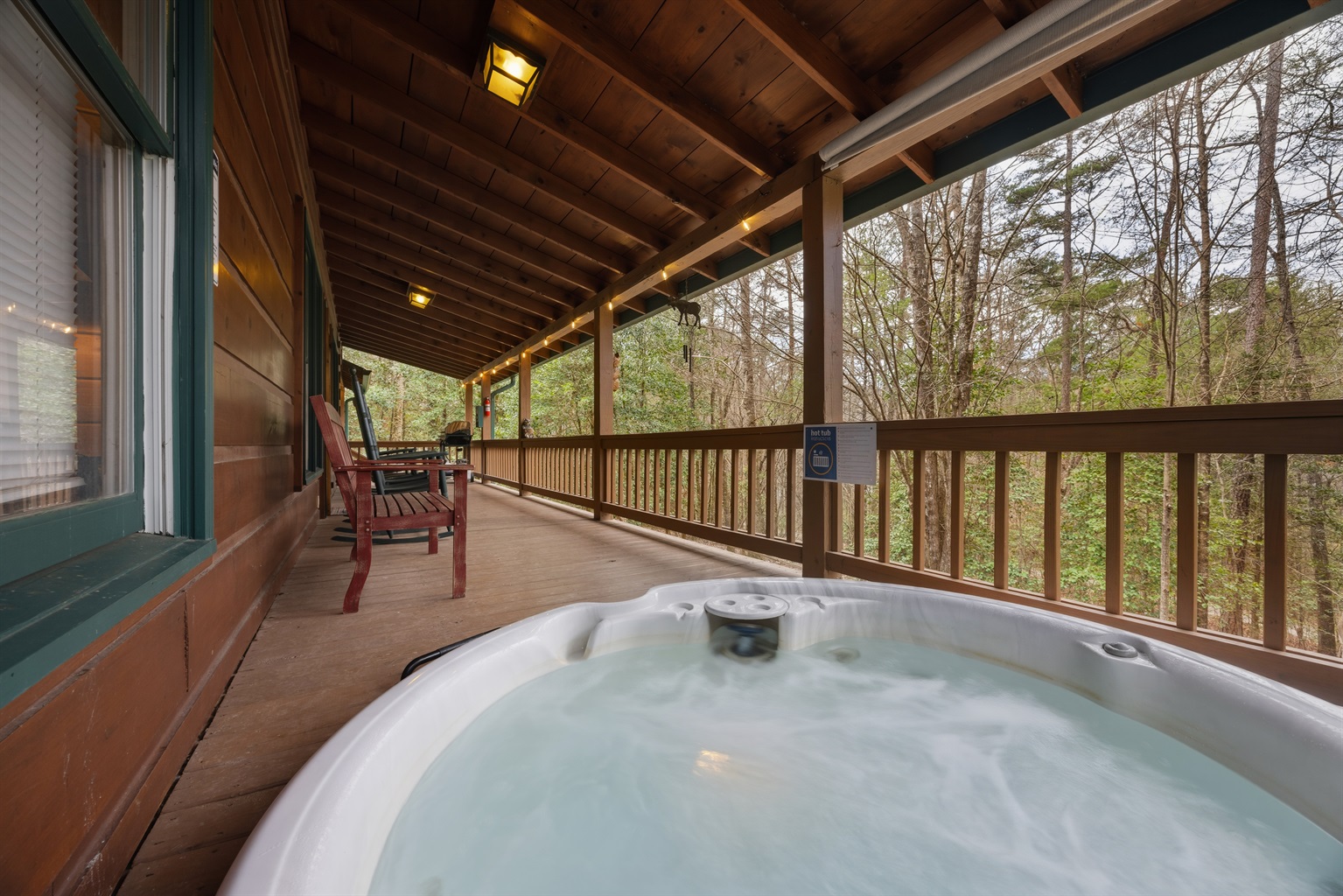 Sunken hot tub on back covered porch