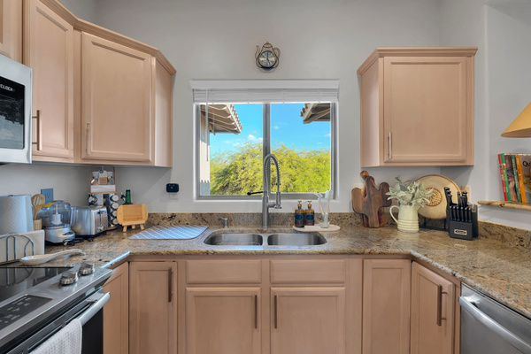 Complete kitchen with granite countertops and open view