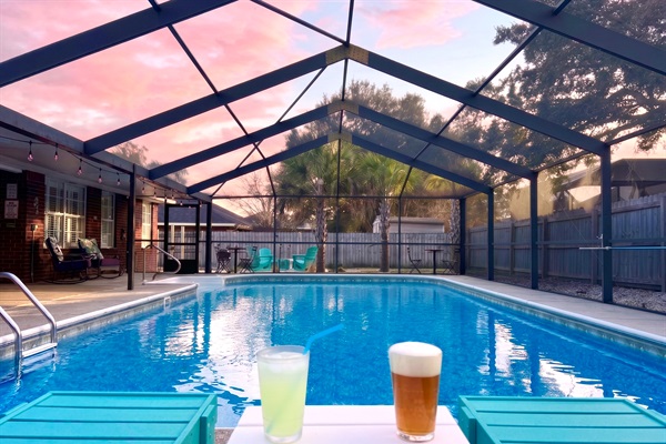 Relax and soak up the sunsets with a cold beverages in Polywood chaise lounges next to the gorgeous, screened-in, and the heated (year round) pool. Cheers!!