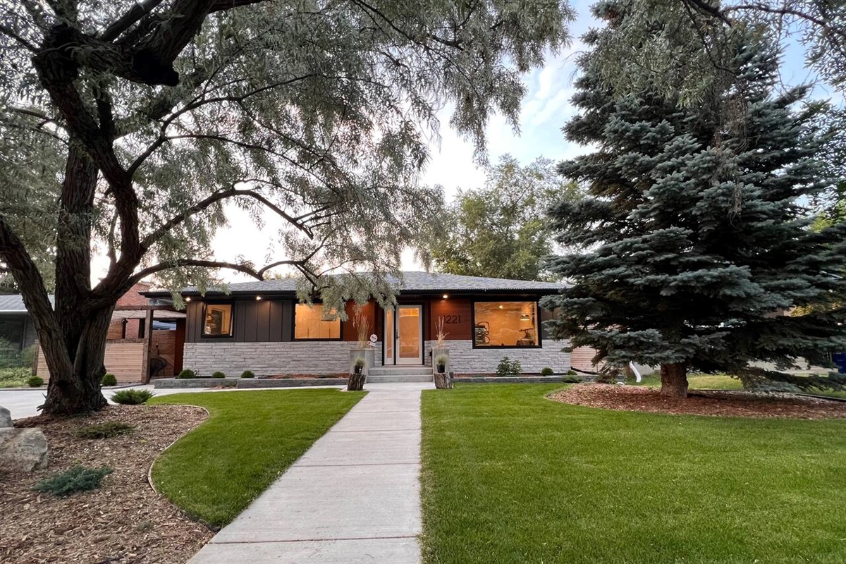 Exterior of the home — the guest suite entrance is through the pergola on the left.