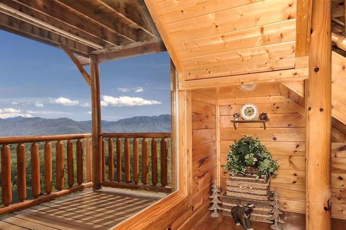 - Upper balcony corner filled with natural light and mountain scenery   - Peaceful nook to unwind with fresh air and endless panoramic views   - A quiet retreat where wood, warmth, and wilderness meet beautifully