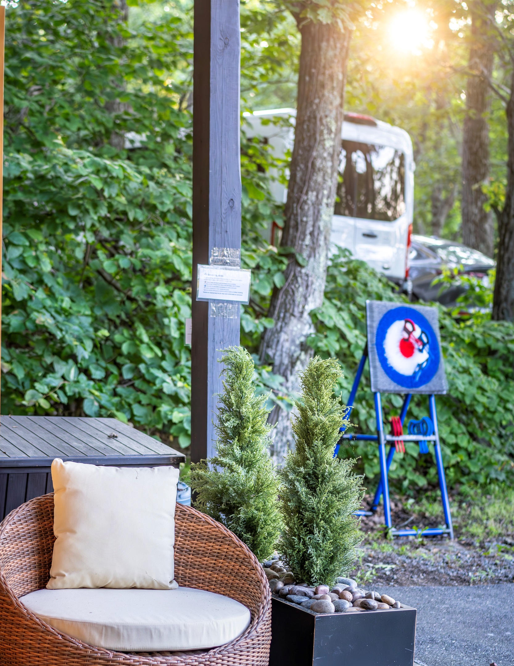 Kick back in the papasan chair or try your hand at our safe, plastic axe throwing set—fun for all ages right outside the sauna, under twinkling lights