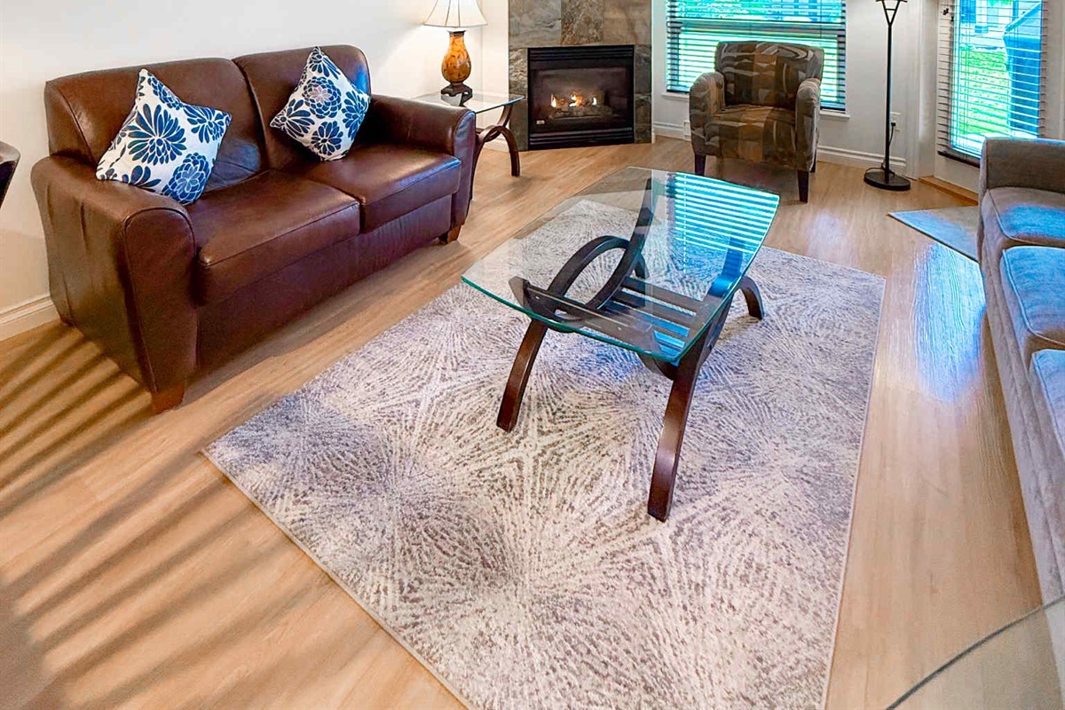 Unit A Living room area. Natural gas fireplace. Streaming TV. Double glass doors to private covered patio.