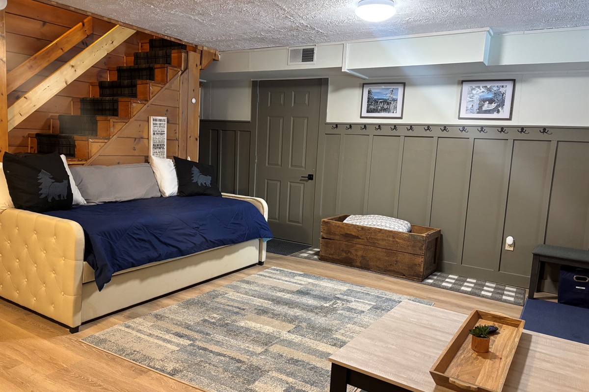 Lower level sitting area with day beds and trundles