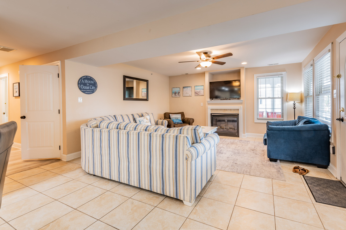 Living Room Area with Striped Sectional and Mounted Flat-Screen TV