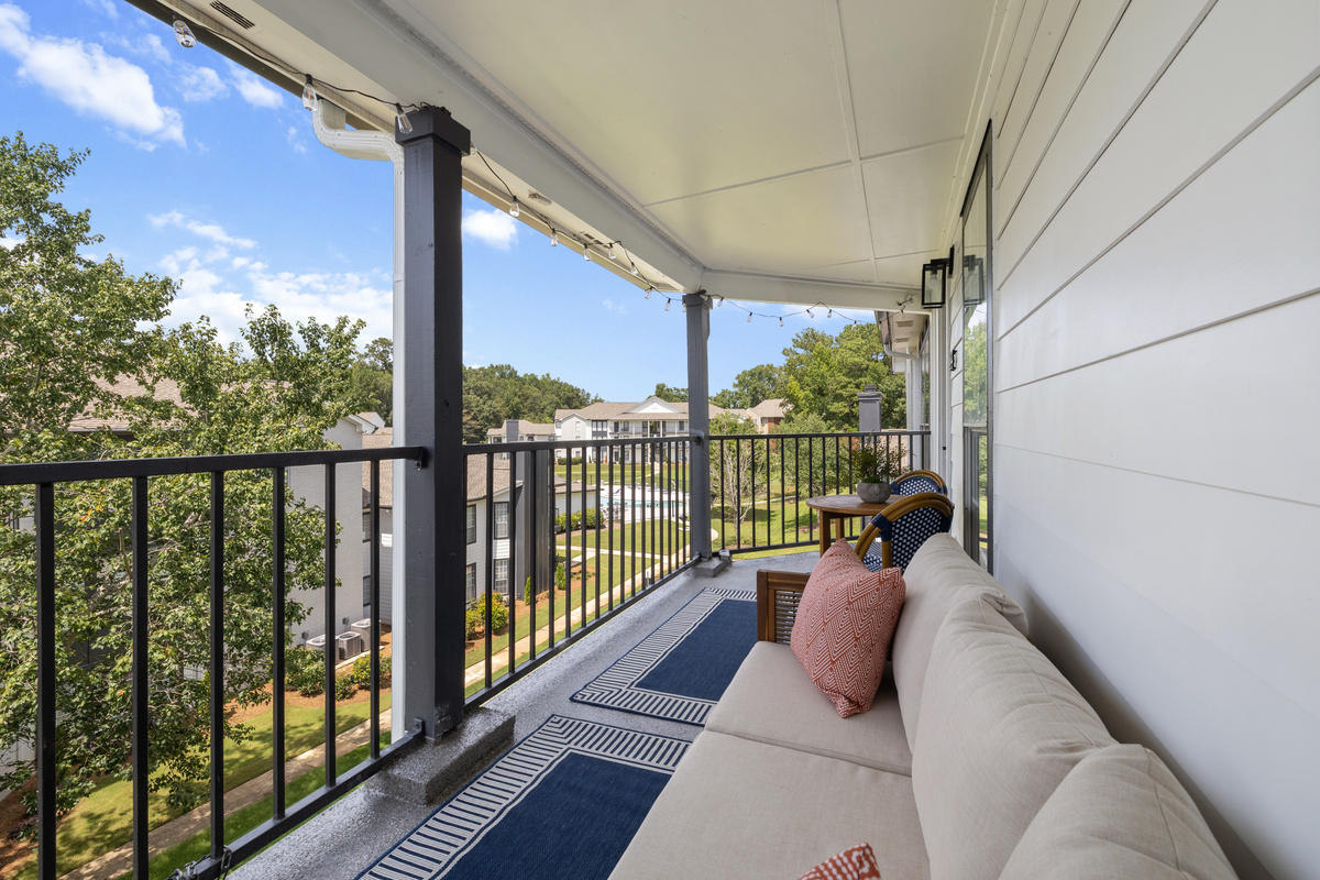 Stretch out on the outdoor sofa with the treetops at eye level.