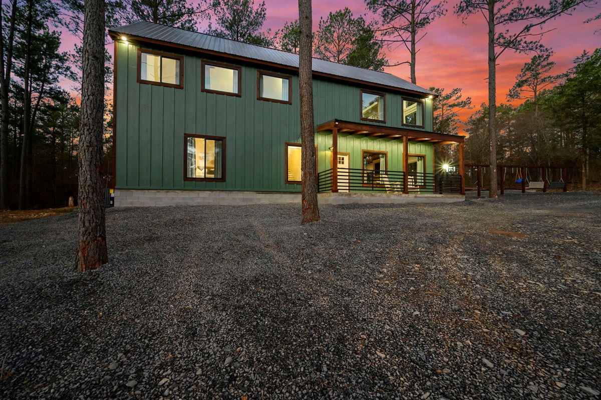 Exterior at sunset &mdash; the ultimate woods getaway 🌅