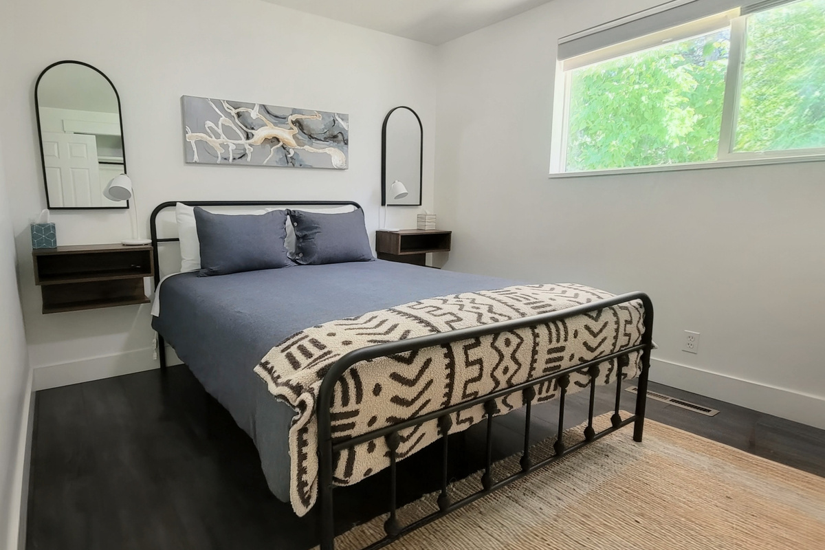 Bright main bedroom with blackout shades.
