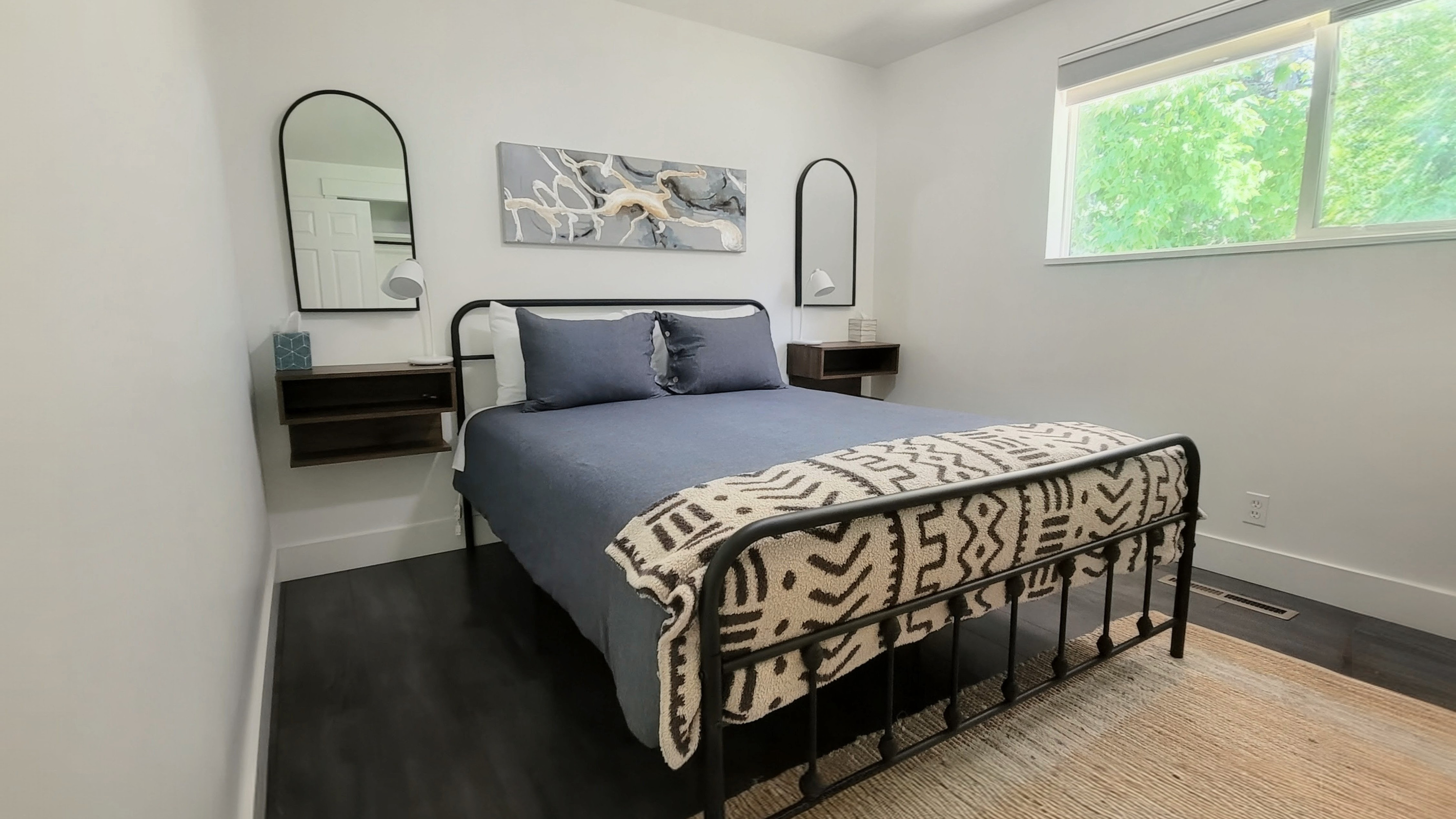 Bright main bedroom with blackout shades.